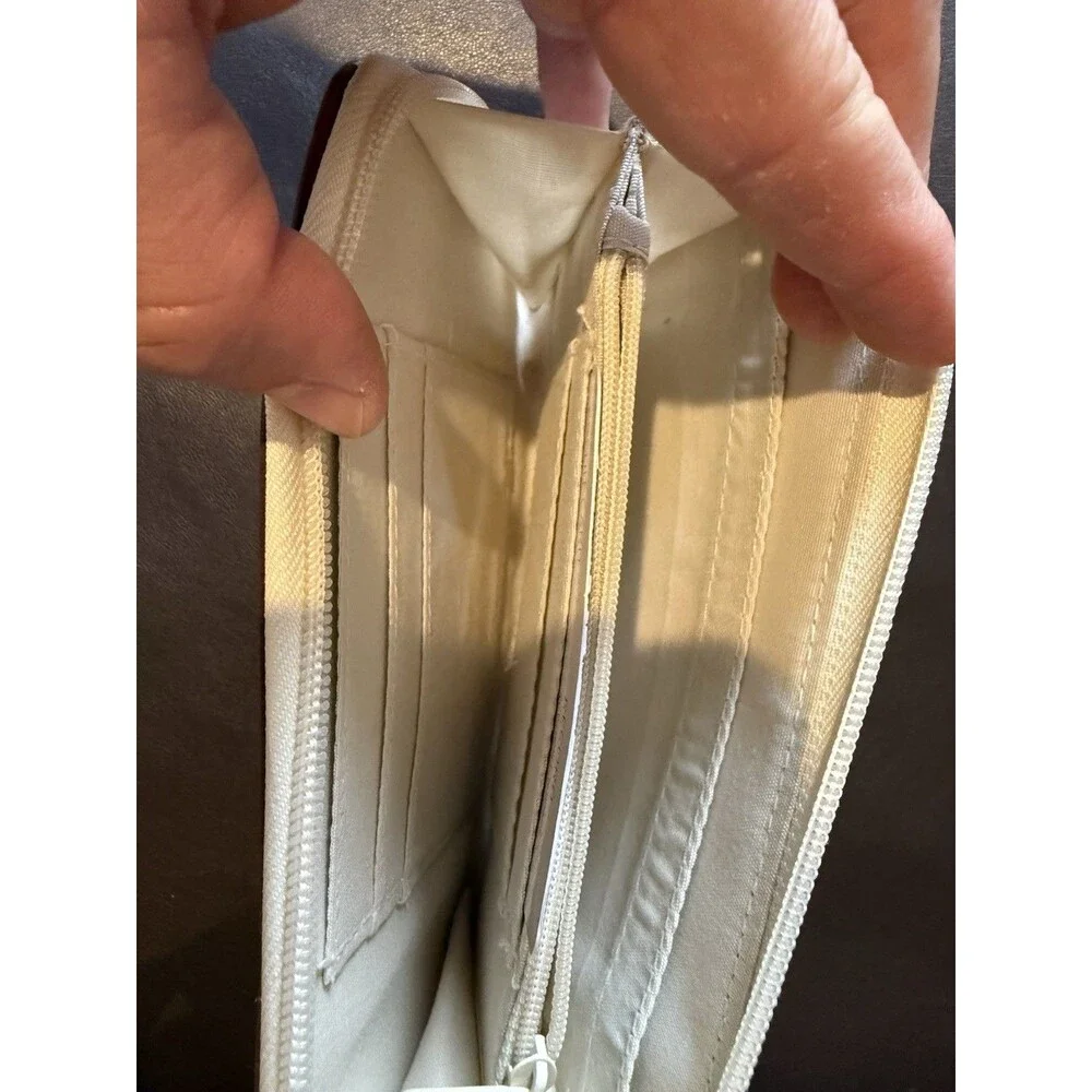 Rosetti shoulder bag with matching wallet in a white and brown color scheme.